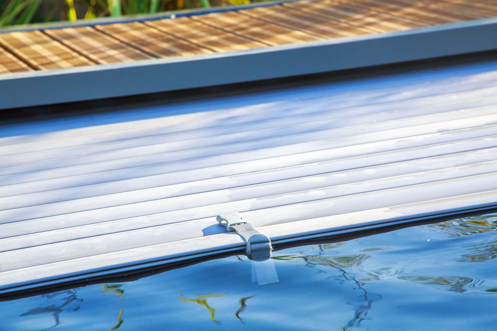 closeup on swimming pool roller-shutter covers