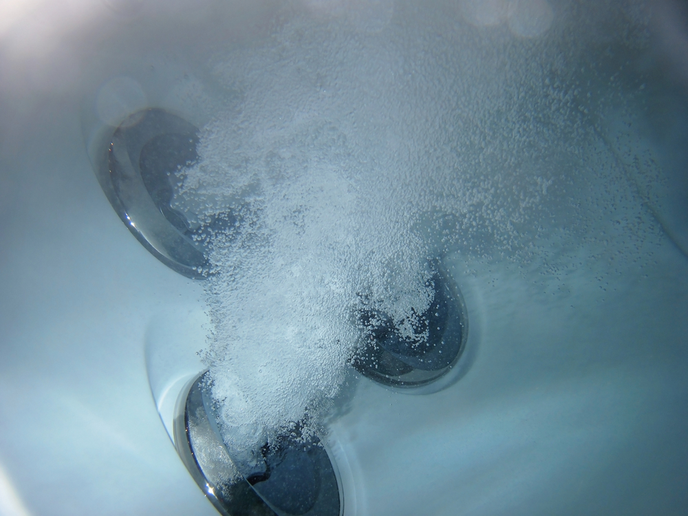 Hot tub jets under water with bubles